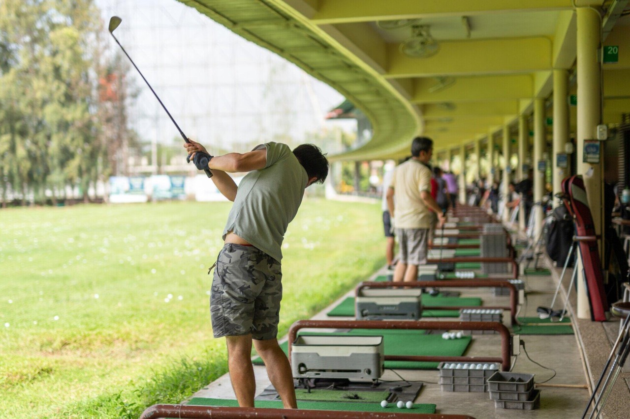 man-practicing-his-golf-swing