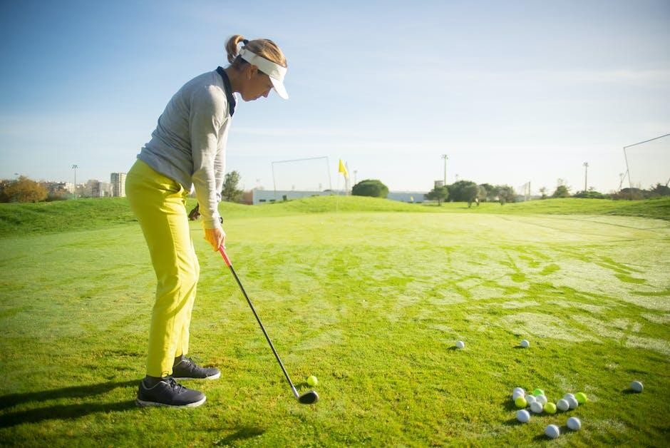woman-taking-golf-lesson
